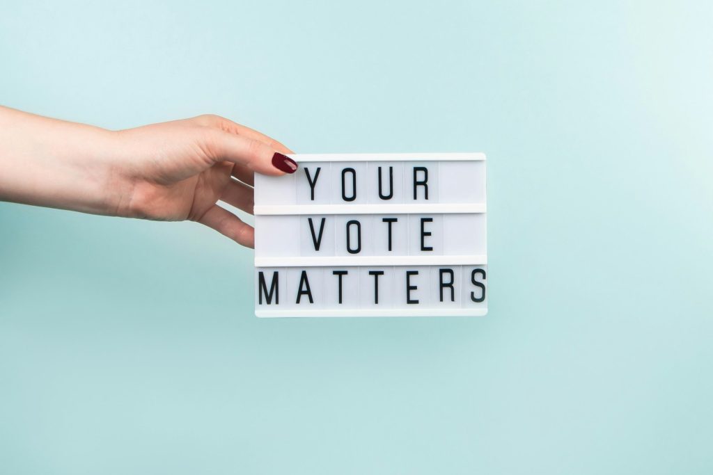 Woman votes in the elections. Voting concept.